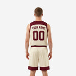 Back view of cream and maroon men's basketball uniform set showing back number placement on jersey and full shorts design