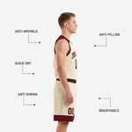 Close detail of fully sublimated maroon and cream basketball jersey showing arced team name, front number, and maroon V-neck binding