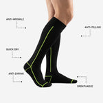 Mens custom black and green soccer socks full length matchday view showing ribbed cuff and over-the-calf coverage