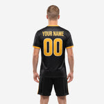 Back view of men's jet black chevron soccer uniform with Athletic Gold player name and number placement