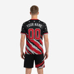 Close detail of black and red soccer uniform jersey showing scarlet team name and number print zones