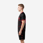 Black and red soccer uniform right side view displaying horizontal red stripe pattern across jersey and shorts