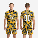 Back view of mens yellow soccer uniform showing back name, back number, and full geometric camo print