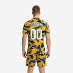 Close detail of Athletic Gold camo soccer jersey showing sublimated team name and front number placement