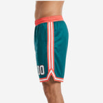 Right side view of custom printed basketball shorts in teal and coral-red showing V-notch side split hem detail and stripe construction