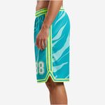 Side view of teal and neon lime custom printed basketball shorts showing full-length lime side stripe and V-notch side split at hem