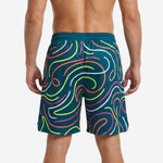 Back view of custom teal basketball shorts with full-bleed neon swirl print and back number placement at the lower hem