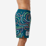 Side view of teal mens custom basketball shorts showing the continuous neon swirl wrap around the leg panel with ribbed elastic waistband