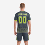 Back view of custom charcoal and neon green soccer outfits for men showing back name and player number placement