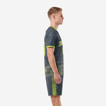Side view of custom charcoal soccer outfits for men showing neon green gradient hex pattern and sleeve trim