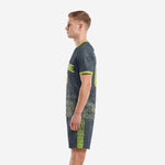 Right side view of men's charcoal neon green soccer uniform with player number on shorts leg and side panel detail