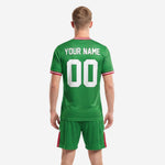 Close detail of Kelly Green soccer jersey geometric sublimated pattern with white team name and number print across chest