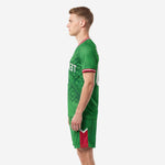 Left side view of mens Kelly Green custom soccer uniform set with dark-green geometric pattern and red accent shorts panel