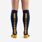 Ribbed cuff detail on custom navy blue soccer socks with Athletic Gold heel, mens knee high length