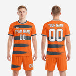 Back view of men's custom orange and graphite soccer uniform showing player name and number print zones