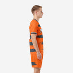 Custom orange soccer outfits for men with Graphite brushstroke bands, left side profile showing shorts and jersey