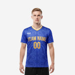 Men custom soccer jerseys in Royal Blue and Athletic Gold with full-dye scroll pattern, V-neck collar, and team name printed on chest