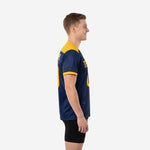 Mens custom training jersey in Navy Blue and Athletic Gold, left side view showing Athletic Gold shoulder panel and cuff trim