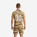 Close detail of mens digital camo sublimated soccer jersey in sand with chocolate brown pixel pattern and white team name print