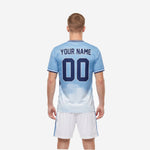 Detail of custom light blue soccer jersey chest showing team name and number print zones