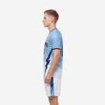 Light blue gradient soccer uniform kit with navy bolt design on jersey and shorts - right side view