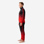 Custom red and black soccer tracksuit side view showing tapered pants with gradient fade from black waistband to fire red ankle