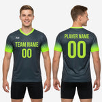 Flat lay of mens custom soccer practice jersey in Graphite and Neon Green gradient showing full sublimation print coverage