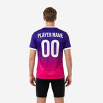Close detail of white V-neck trim and Royal Purple gradient on custom pink soccer training jersey, sublimated finish