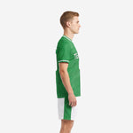 Custom green soccer uniforms left side view showing topographic contour print on Kelly Green jersey and white shorts