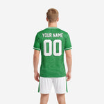 Close detail of custom Kelly Green soccer jersey with white crew neck trim and topographic line pattern sublimation