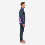 Mens custom soccer tracksuit design in charcoal with purple and pink floral sleeve panel, side view showing raglan sleeve construction and tapered pant leg