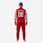 Custom red soccer tracksuit jacket detail showing tiger-stripe sublimation on sleeve and chest team logo print zone