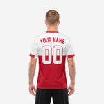 Close detail of red and white colorblock custom soccer jersey showing horizontal stripe divider and printed team name on chest panel