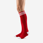 Mens red and white soccer socks angled side view with solid red calf panel and white toe cap