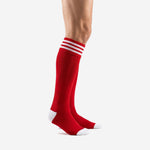Mens red soccer socks side view showing over the calf length and white stripe cuff detail