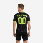 Mens soccer practice jersey in black and neon green showing back player name and number print