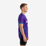 Custom mens soccer practice jersey side view showing full-dye sublimation neon circuit pattern across sleeve and body in Royal Purple with Turquoise cuff trim