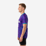 Sublimated mens soccer training jersey right side view displaying Royal Purple geometric print with Hot Pink and Turquoise node lines from shoulder to hem