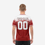 Full-dye sublimation detail on dark red men's soccer team jerseys showing pixel square pattern transition