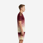 Left side view of custom maroon gradient men's soccer team uniform showing gold sleeve stripes and matching gradient shorts