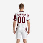 Men's soccer team uniforms front detail view showing maroon splash graphic panels and halftone dot transition on white polyester jersey