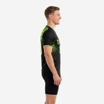 Side view of mens soccer training jersey showing neon green hex print across shoulder and sleeve panels on black polyester fabric