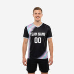 Mens soccer training top in jet black with iridescent multicolor gradient panel, white team name and number on chest, front view