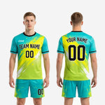 Full back view of mens soccer uniform men in teal and neon yellow showing player surname, back number, and full-dye sublimation print coverage
