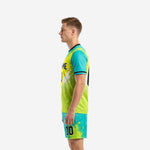 Mens soccer uniform in teal and neon yellow, right side view displaying halftone dot pattern and athletic-cut sublimated jersey with shorts