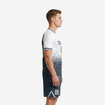 Men's soccer uniforms white and charcoal dot-burst kit, left side profile showing jersey fade pattern and matching shorts