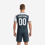 Custom men's soccer jersey in white and charcoal scatter print, V-neck collar and chest team name detail