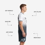 Custom charcoal soccer shorts with dot-burst sublimation print, white chevron accent and player number on left leg