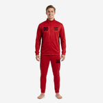 Men's custom red soccer tracksuit with Jet Black splash side panels, front view showing full zip jacket and tapered pants