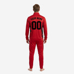 Close detail of red soccer tracksuit jacket with stand collar, full zip, and sublimated Jet Black splash side panel print